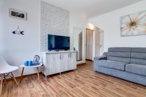 TV a/nebo společenská místnost v ubytování Hotel Sara