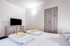 Postel nebo postele na pokoji v ubytování Hotel Sara