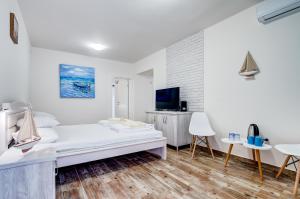 Vuode tai vuoteita majoituspaikassa Hotel Sara