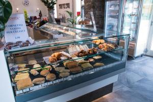 a display case filled with different types of pastries at B&B SILVIA in Vecchiano