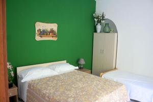 Postel nebo postele na pokoji v ubytování Agriturismo Parco dai Nonni