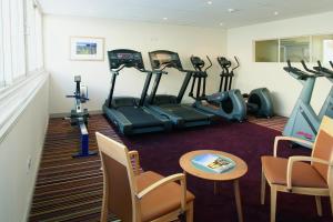 a gym with several exercise bikes in a room at ABode Canterbury in Canterbury