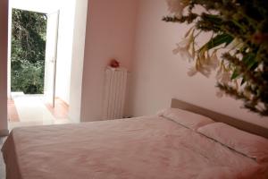 Postel nebo postele na pokoji v ubytování Agriturismo Parco dai Nonni
