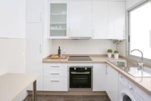 Kuchyň nebo kuchyňský kout v ubytování Apartamento L&G Centro