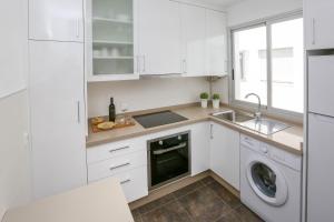 Kuchyň nebo kuchyňský kout v ubytování Apartamento L&G Centro