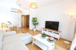 TV a/nebo společenská místnost v ubytování Apartamento L&G Centro