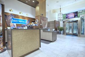 a restaurant lobby with a box works counter at Club Wyndham Midtown 45 in New York