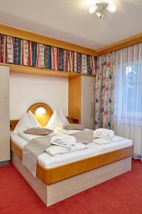 מיטה או מיטות בחדר ב-Pension Haus Aschgan