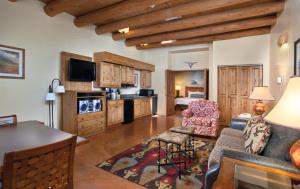 a living room with a couch and a kitchen at WorldMark Santa Fe in Santa Fe