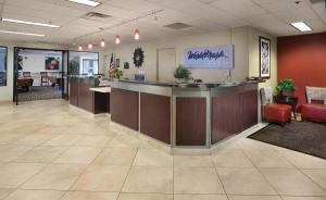 an office lobby with a reception counter and chairs at WorldMark Reno in Reno