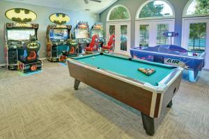 a room with a pool table and arcade games at Club Wyndham Kingsgate in Williamsburg