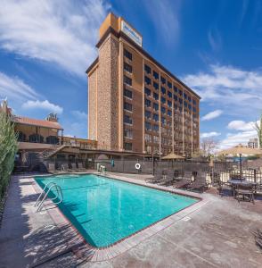 a hotel with a swimming pool in front of a building at WorldMark Reno in Reno