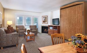 a living room with a couch and a fireplace at WorldMark Grand Lake in Monkey Island