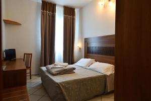 Cama o camas de una habitación en Hotel Oasis