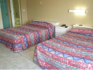 Postel nebo postele na pokoji v ubytování Miami Princess Hotel