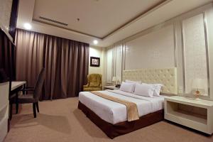 Postel nebo postele na pokoji v ubytování Jindagu Hotel Ipoh