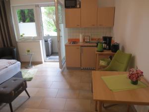 A kitchen or kitchenette at Ferienwohnungen Fritz
