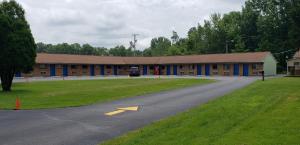 a large building with a road in front of it at Westgate Motel in Youngstown