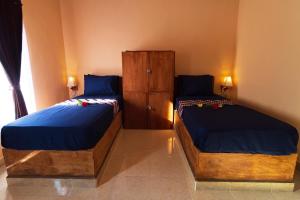 Кровать или кровати в номере Surf Camp 79