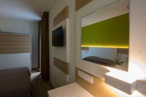 Postel nebo postele na pokoji v ubytování Almalux Jesolo Wellness & Spa 3 stelle superior + 37 fotografií