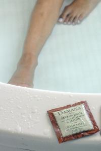 a cake with a persons leg in a bath tub at Be Playa in Playa del Carmen