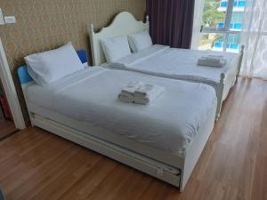 Postel nebo postele na pokoji v ubytování My Resort Huahin C605