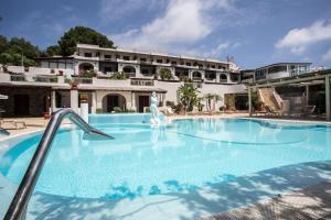 a large swimming pool in front of a building at Hotel Tritone Lipari in Lipari