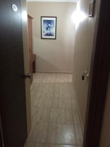 a hallway with a door and a tile floor at Serendi Apart Hotel in Alanya