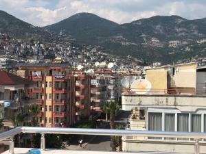 a view of a city with buildings and mountains at Serendi Apart Hotel in Alanya
