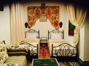 A bed or beds in a room at Dar Hafsa