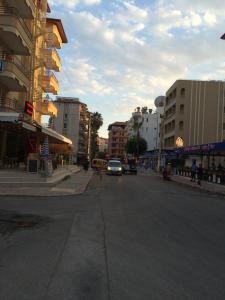 a city street with a car driving down the street at Serendi Apart Hotel in Alanya