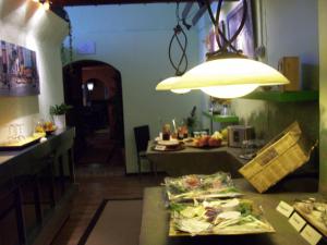 a kitchen with a table with food on it at Fritzis Art Hotel in Filderstadt