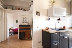 Kuchyň nebo kuchyňský kout v ubytování Via Pai Home Accogliente bilocale a due passi da Firenze Wi-Fi veloce & parcheggio gratuito + 9 fotografií