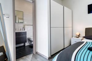 a bedroom with a bed and a bathroom at Apartment Del Mar in Podstrana +61 photos