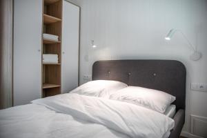 Postel nebo postele na pokoji v ubytování Słowiński Zakątek