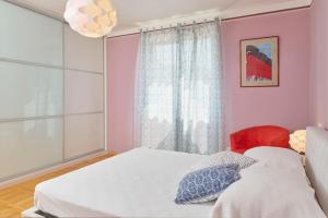 Кровать или кровати в номере Villa Giardina Apartments