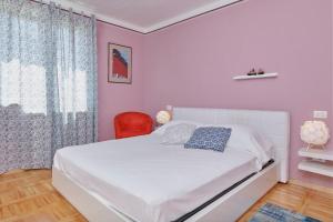 Кровать или кровати в номере Villa Giardina Apartments
