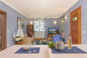 Гостиная зона в Villa Giardina Apartments