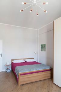 Postel nebo postele na pokoji v ubytování Via Pai Home Accogliente bilocale a due passi da Firenze Wi-Fi veloce & parcheggio gratuito