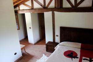 Un pat sau paturi într-o cameră la Complejo Rural La Coronilla
