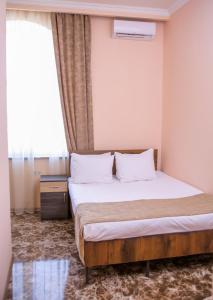 Voodi või voodid majutusasutuse Red Hotel Yerevan Center toas