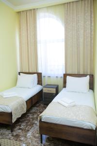 Voodi või voodid majutusasutuse Red Hotel Yerevan Center toas