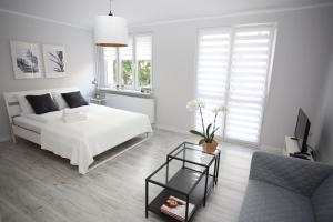 Posteľ alebo postele v izbe v ubytovaní APARTAMENT SŁOBÓDZKIEGO 7