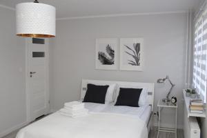 Posteľ alebo postele v izbe v ubytovaní APARTAMENT SŁOBÓDZKIEGO 7 + 3 fotografie