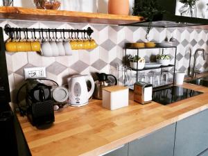 a kitchen counter with various appliances on it at IL CUCCO B&B in Ginosa Marina