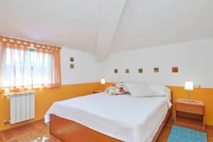 Кровать или кровати в номере Villa Giardina Apartments