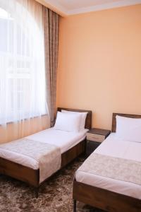 Voodi või voodid majutusasutuse Red Hotel Yerevan Center toas