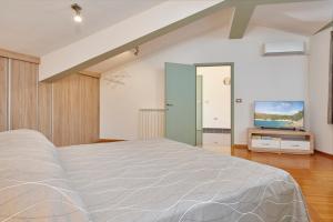 Кровать или кровати в номере Villa Giardina Apartments