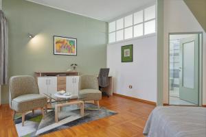 Гостиная зона в Villa Giardina Apartments
