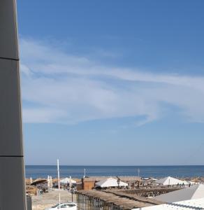 a view of a beach with the ocean in the background at Suite pe plaja de lux in Mamaia Nord